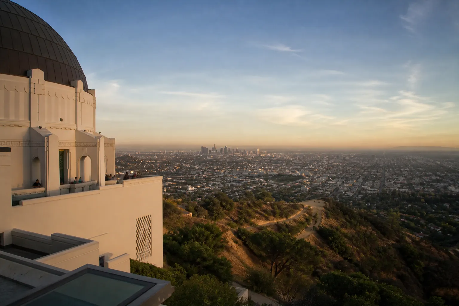 Griffith Observatory and a panoramic Los Angeles view during golden hour.
